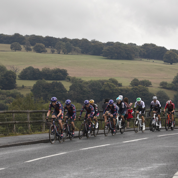 Tour of Britain 2025 - The peloton passes by beautiful Welsh countryside in Markham