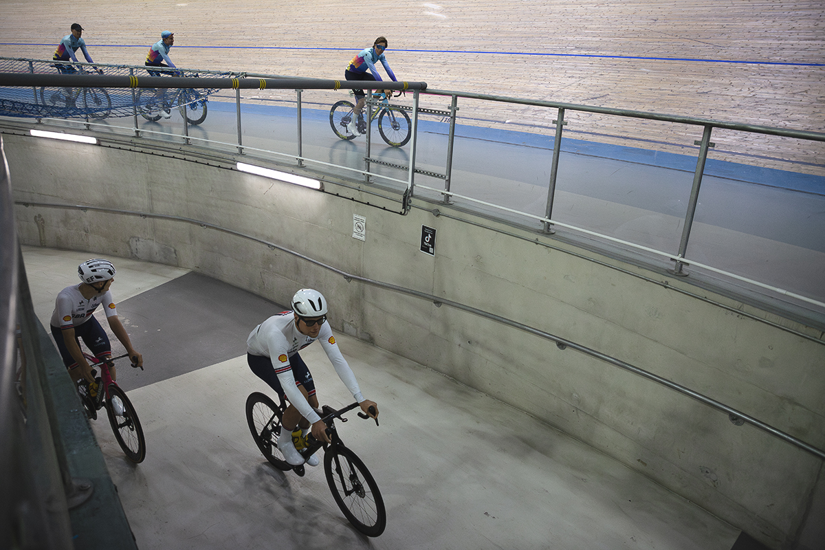 Tour of Britain 2025 - Riders enter the velodrome up a concrete tunnel while another team rides round the track during the team presentations