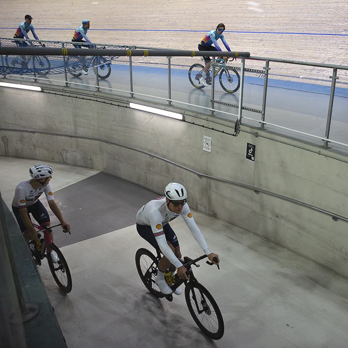 Tour of Britain 2025 - Riders enter the velodrome up a concrete tunnel while another team rides round the track during the team presentations