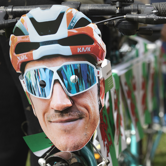 Tour of Britain 2025 - A Tandem bike is adorned with Welsh flag bunting and a Geraint Thomas mask