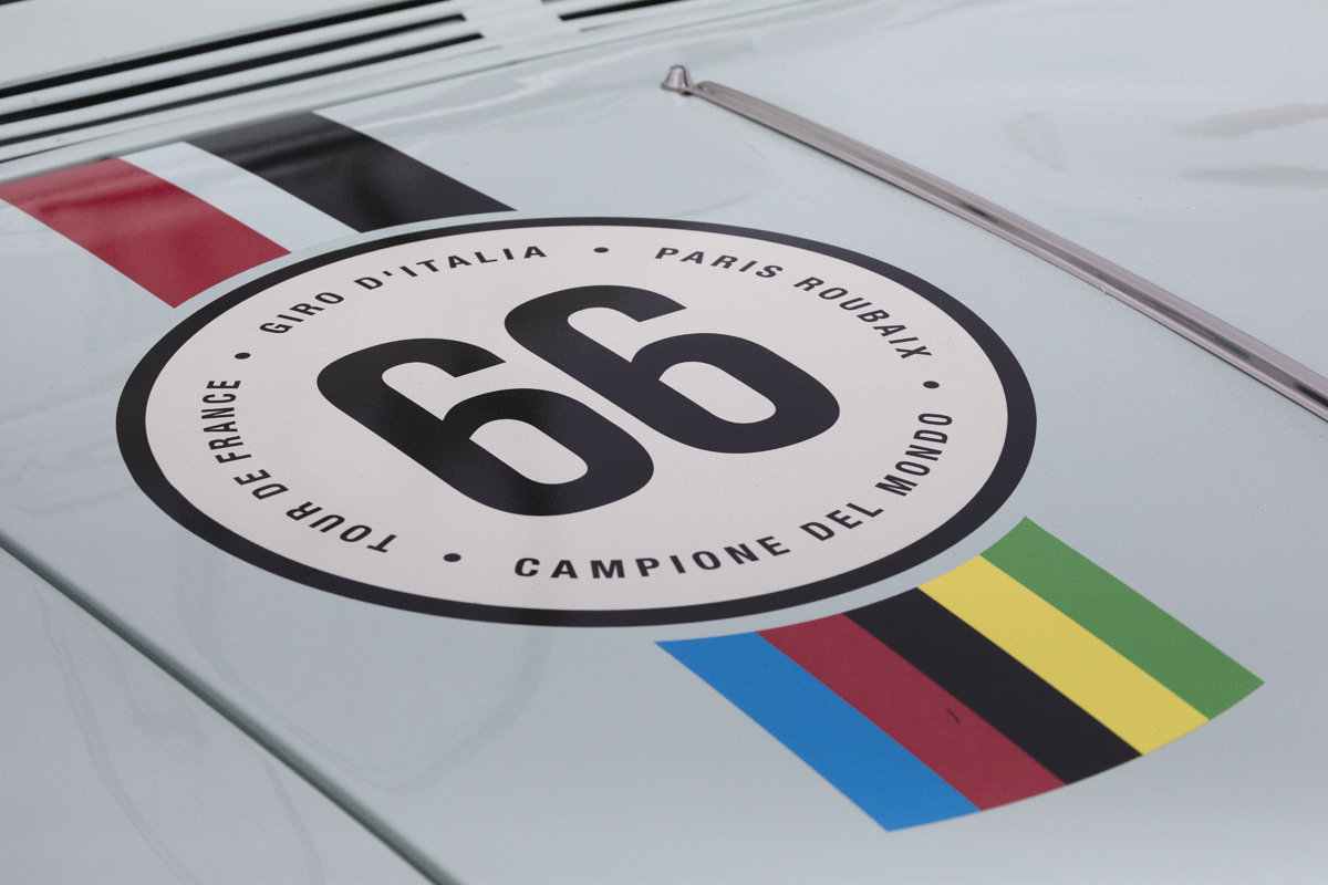 Tour of Britain 2025 - An old Alfa-Romeo with its livery in the style of a Bianchi cycle race team car