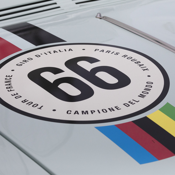 Tour of Britain 2025 - An old Alfa-Romeo with its livery in the style of a Bianchi cycle race team car