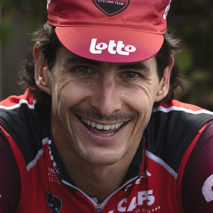 Tour of Britain 2025 - Cedric Beullens of Lotto smiles while wearing a small Lotto branded cap old skool
