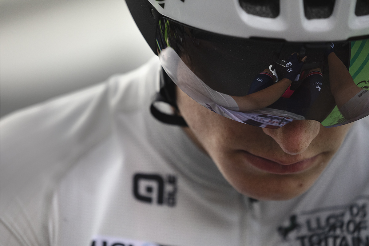 Tour of Britain 2025 - Josh Golliker wearing the best young riders jersey looks downwards