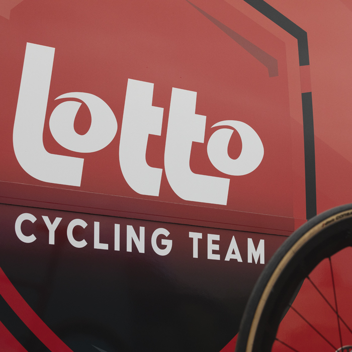 Tour of Britain 2025 - The Lotto cycling team bus with their bikes on a team car in the foreground