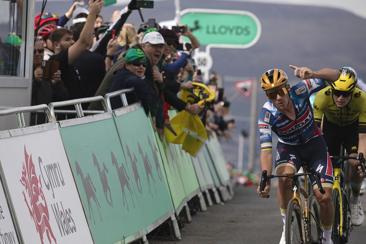 Tour of Britain 2025 - Remco Evenepoel raises his finger in the air as he crosses the line victorious