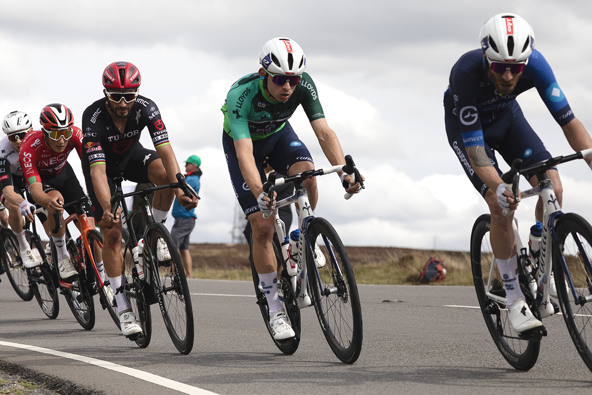 Tour of Britain 2025 - Romain Grégoire wearing the race leader’s jersey is followed by Julian Alaphilippe in the descent of the hill