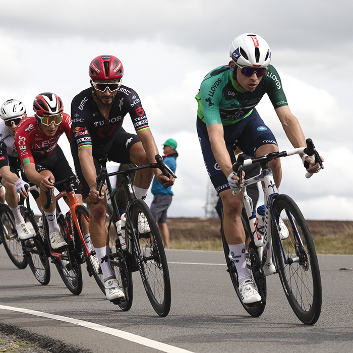 Tour of Britain 2025 - Romain Grégoire wearing the race leader’s jersey is followed by Julian Alaphilippe in the descent of the hill