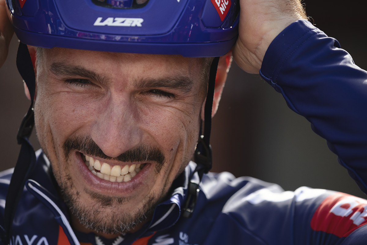 Tour of Britain 2025 - John Degenkolb of Team Picnic PostNL smiles as he adjusts his helmet before the team presentation
