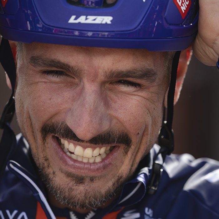 Tour of Britain 2025 - John Degenkolb of Team Picnic PostNL smiles as he adjusts his helmet before the team presentation