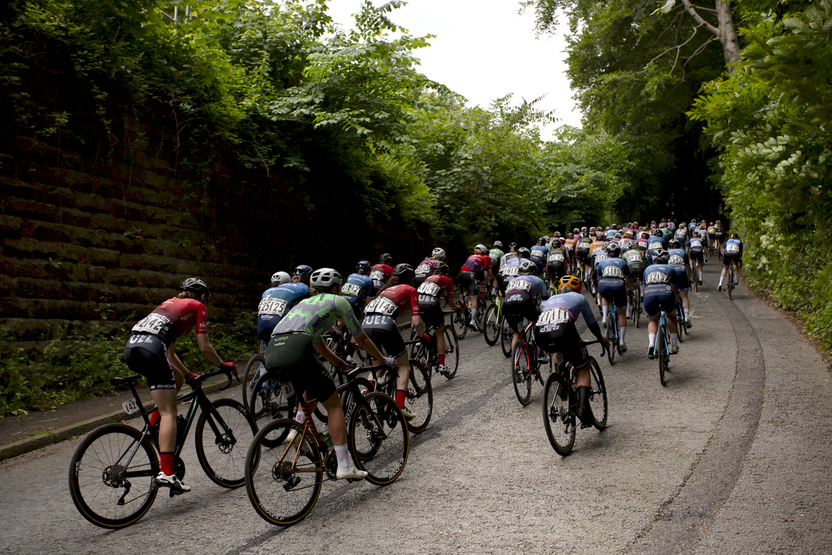 Tour of Britain Women’s 2024 - A group of riders takes on the short climb towards Gresford