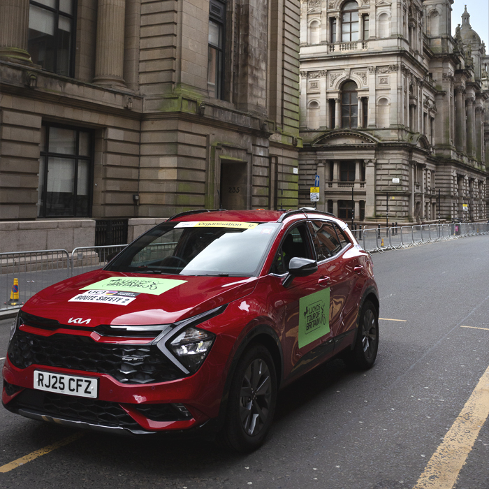Tour of Britain Women’s 2025 - Stage 4 - The red safety car makes a pass of the circuit in Glasgow
