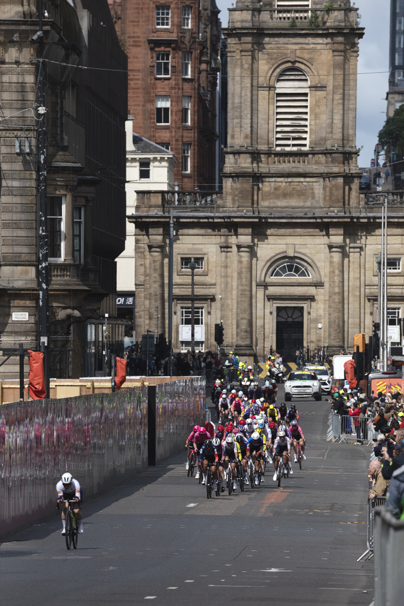Tour of Britain Women’s 2025 - Stage 4 - St George’s Tron Church of Scotland in the background as riders are reflected in hoardings
