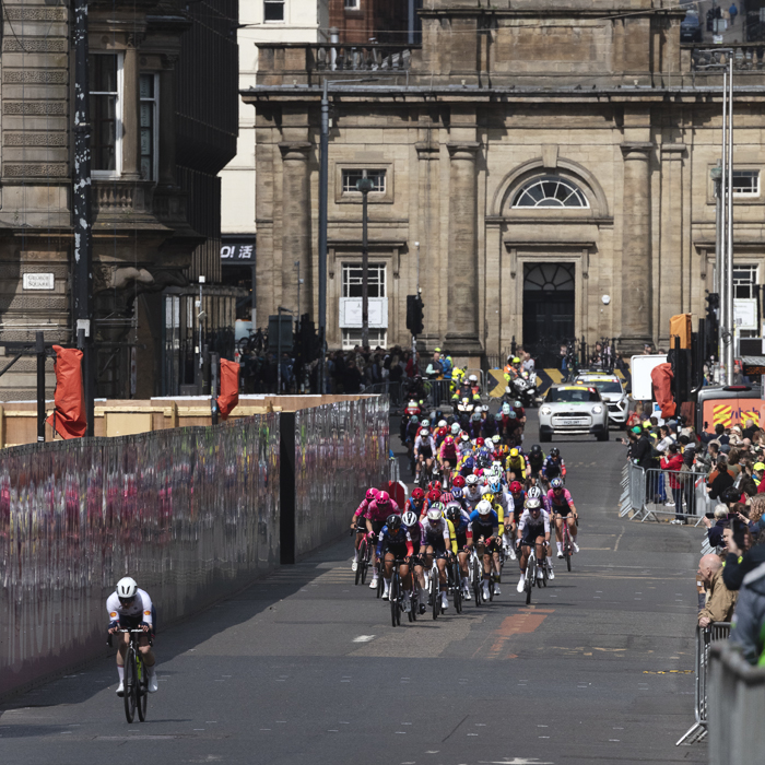 Tour of Britain Women’s 2025 - Stage 4 - St George’s Tron Church of Scotland in the background as riders are reflected in hoardings