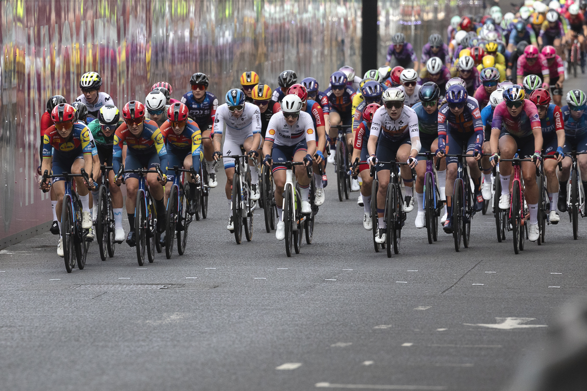 Tour of Britain Women’s 2025 - Stage 4 - Riders reflected in hoardings around George Square