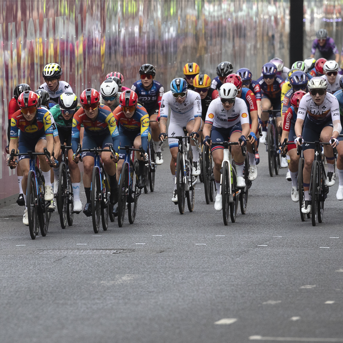 Tour of Britain Women’s 2025 - Stage 4 - Riders reflected in hoardings around George Square
