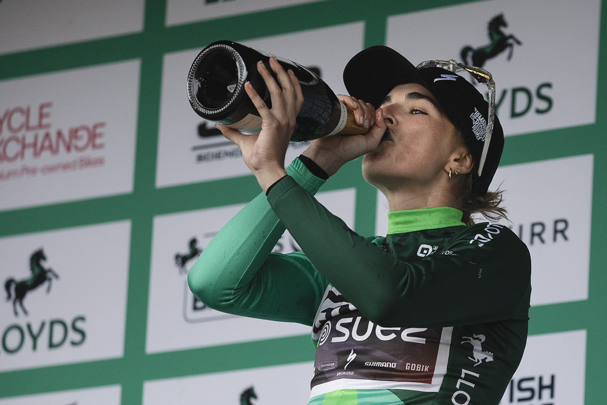 Tour of Britain Women’s 2025 - Stage 4 - Ally Wollaston with a celebratory drink on the podium
