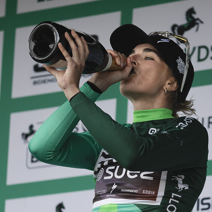 Tour of Britain Women’s 2025 - Stage 4 - Ally Wollaston with a celebratory drink on the podium