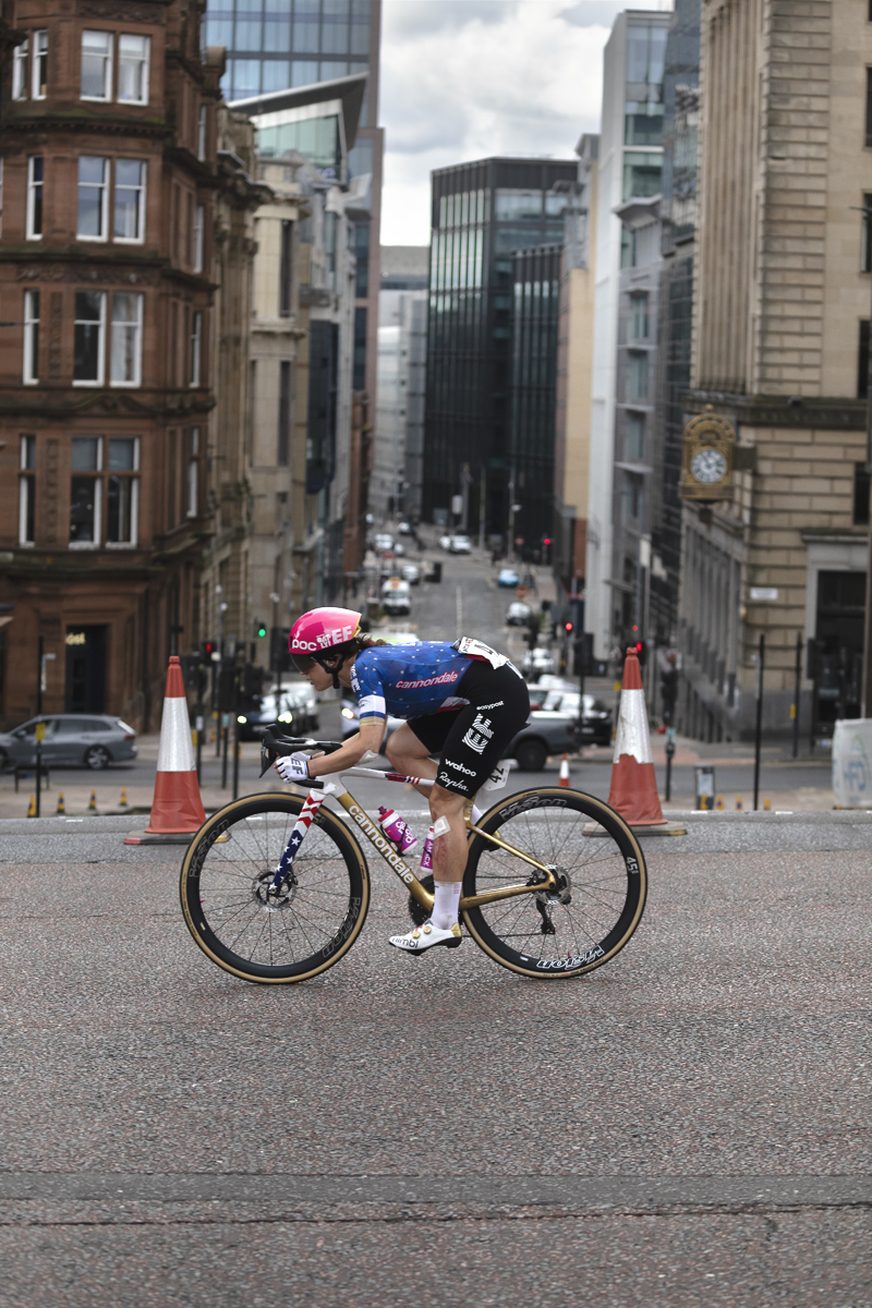 Tour of Britain Women’s 2025 - Stage 4 - Kristen Faulkner races through the streets of Glasgow with tall city buildings as a backdrop