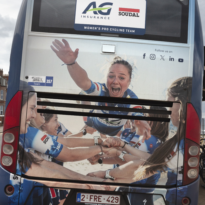 Tour of Britain Women’s 2025 - Stage 1 - Back of the AG Insurance - Soudal Team bus showing a striking image of the team