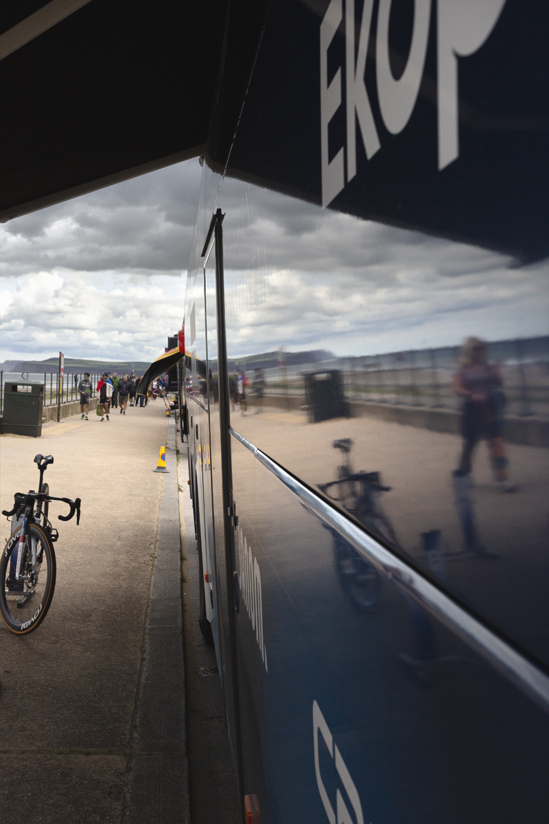 Tour of Britain Women’s 2025 - Stage 1 - Redcar Reflections; the seafront is reflected in the side of a team bus