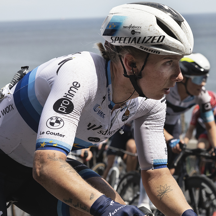 Tour of Britain Women’s 2025 - Stage 2 - Lorena Wiebes with the sea in the background as she tackles the climb at Saltburn