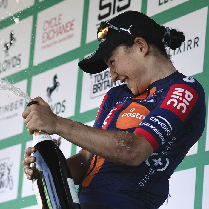 Tour of Britain Women’s 2025 - Stage 2 - Mara Roldan celebrates with a bottle of fizzy wine on the podium