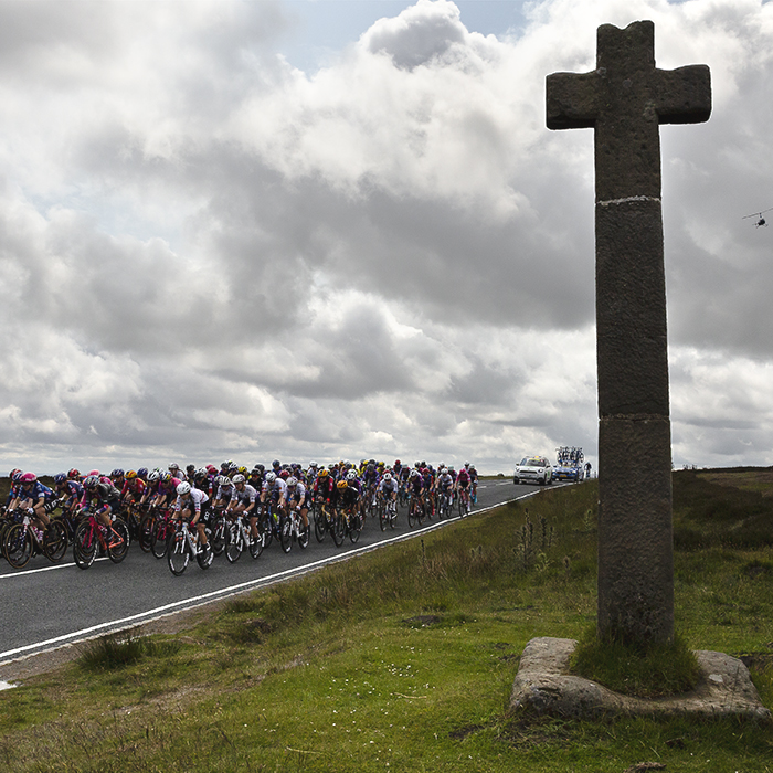 Tour of Britain Women’s 2025 - Stage 1 - The peloton passes by Young Ralph Cross in the North York Moors National Park
