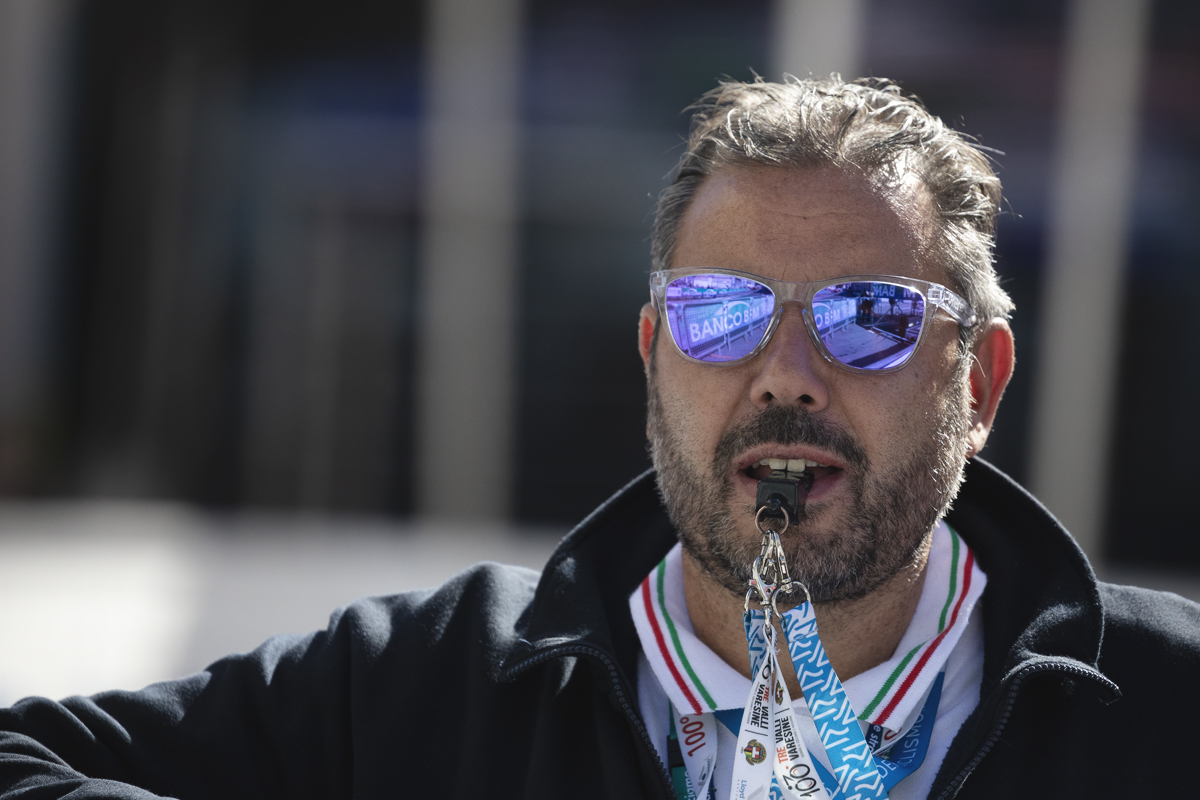 Tre Valli Varesine 2025 - One of the race officials puts his whistle to his mouth, anticipating the arrival of the riders