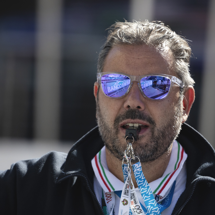 Tre Valli Varesine 2025 - One of the race officials puts his whistle to his mouth, anticipating the arrival of the riders