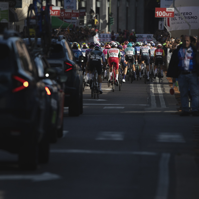 Tre Valli Varesine 2025 - The peloton from the race convoy is lit by the autumnal sun
