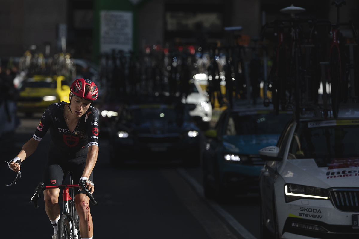 Tre Valli Varesine 2025 - Hannes Wilksch of Tudor Pro Cycling Team with his sunglasses in his hand and a bloody knee following a crash in the race
