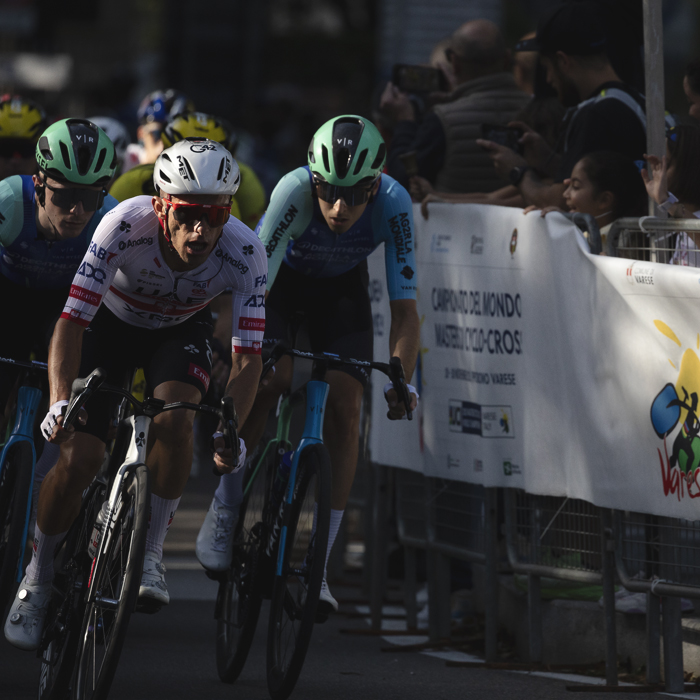 Tre Valli Varesine 2025 - Rafał Majka leads a group of riders through the streets of Varese