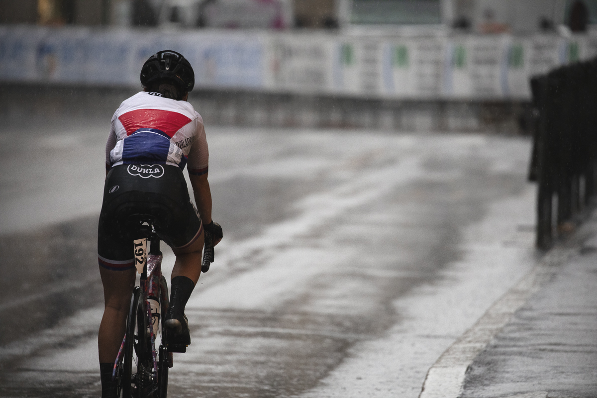 Tre Valli Varesine Women’s Race 2024 - Barbora Němcová wearing a rain jacket heads back to the buses having abandoned the race