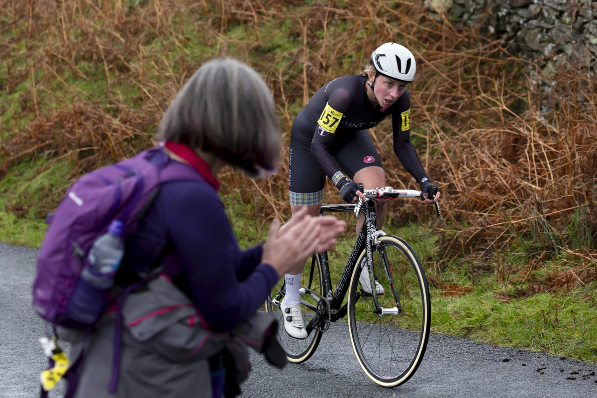 UK National Hill Climb Championships 2023 - Christina Wiejak passes a fan who applauds as she makes her way up the climb