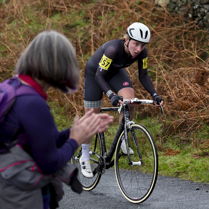 UK National Hill Climb Championships 2023 - Christina Wiejak passes a fan who applauds as she makes her way up the climb