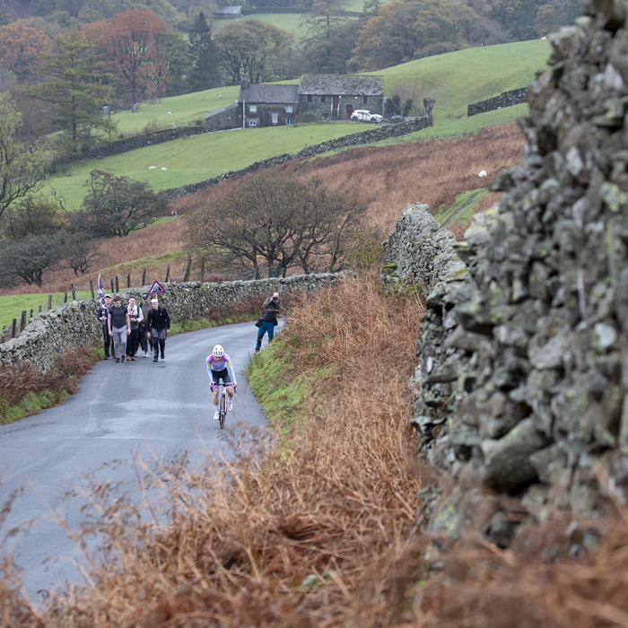 UK National Hill Climb Championships 2023 - Frances Owen on The Struggle with a Cumbrian farmhouse in the distance behind her