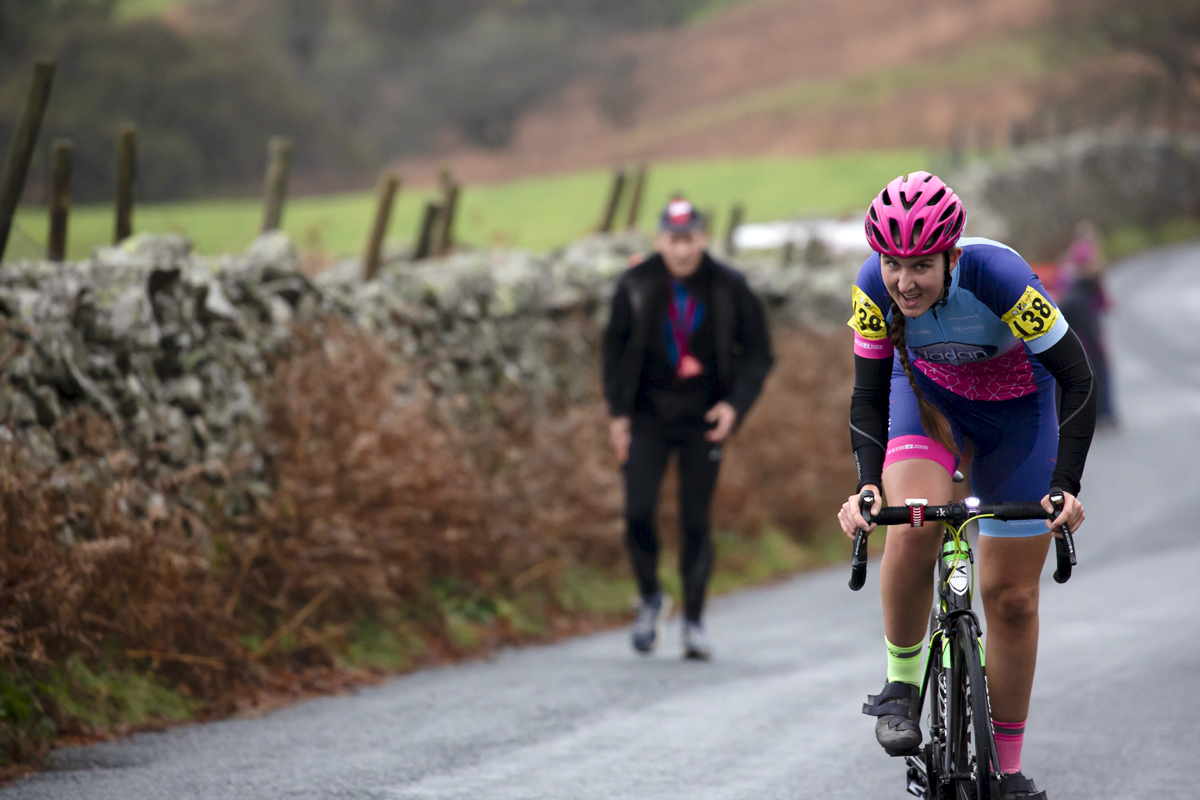 UK National Hill Climb Championships 2023 - Kirstie Drakeford stands on her pedals as she climbs The Struggle