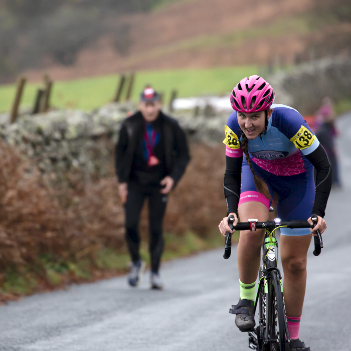 UK National Hill Climb Championships 2023 - Kirstie Drakeford stands on her pedals as she climbs The Struggle